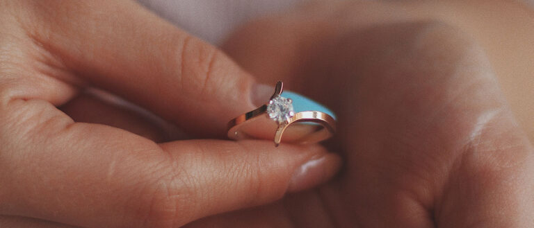Sparkling diamond engagement ring with lab-grown diamond on a woman's finger.